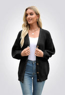 Svart stickad tröja med knappar framtill och långa ärmar