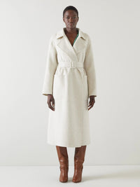 Ullkappa med dubbla rader knappar och skärp i midjan