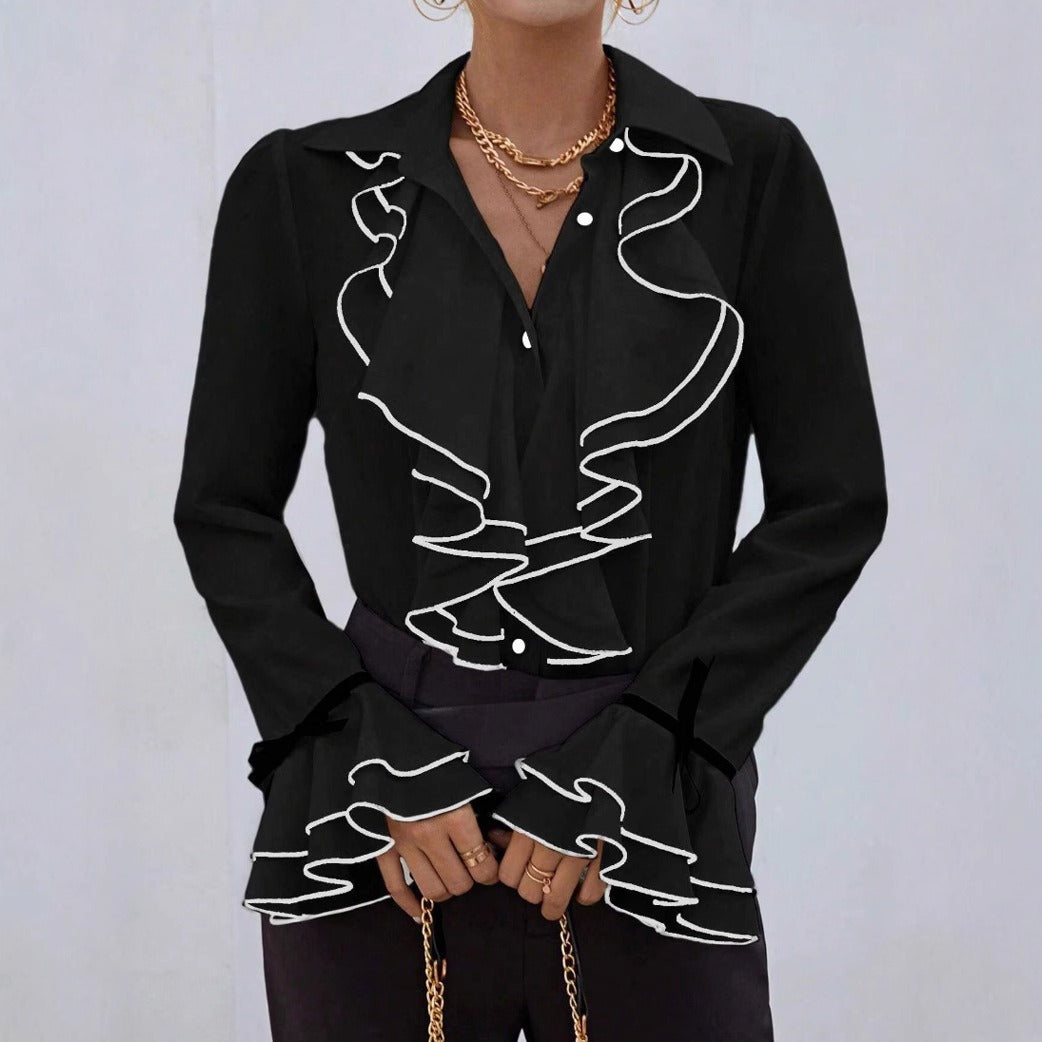 Avslappnad blus med utsvängda ärmar och vågig krage