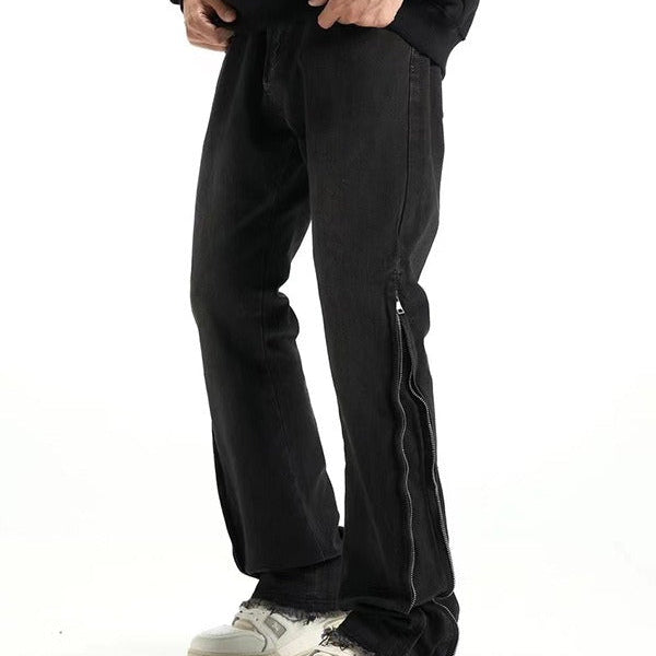 Svarta jeansbyxor med dragkedja nedtill