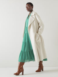 Ullkappa med dubbla rader knappar och skärp i midjan