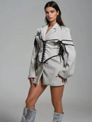 Långärmad jacka med knappar och korsett