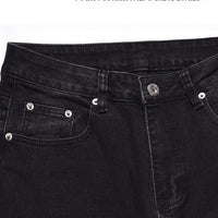 Svarta jeansbyxor med dragkedja nedtill