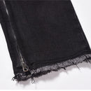 Svarta jeansbyxor med dragkedja nedtill