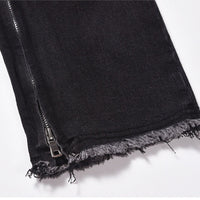 Svarta jeansbyxor med dragkedja nedtill