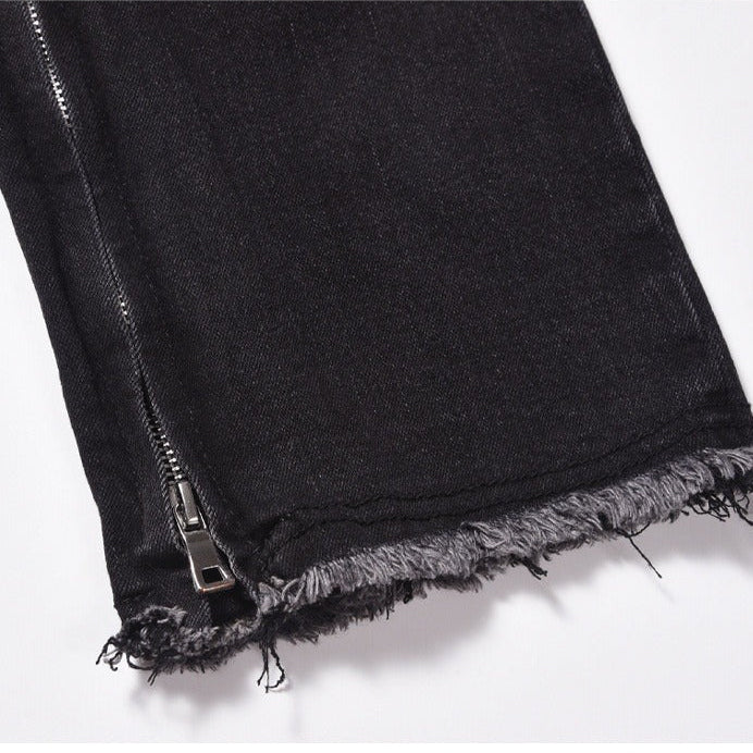 Svarta jeansbyxor med dragkedja nedtill