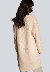 Lång beige stickad kofta med fickor