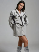 Långärmad jacka med knappar och korsett