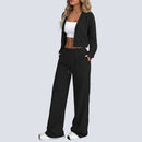 Tvådelad stickad kostym med blus med knappar framtill