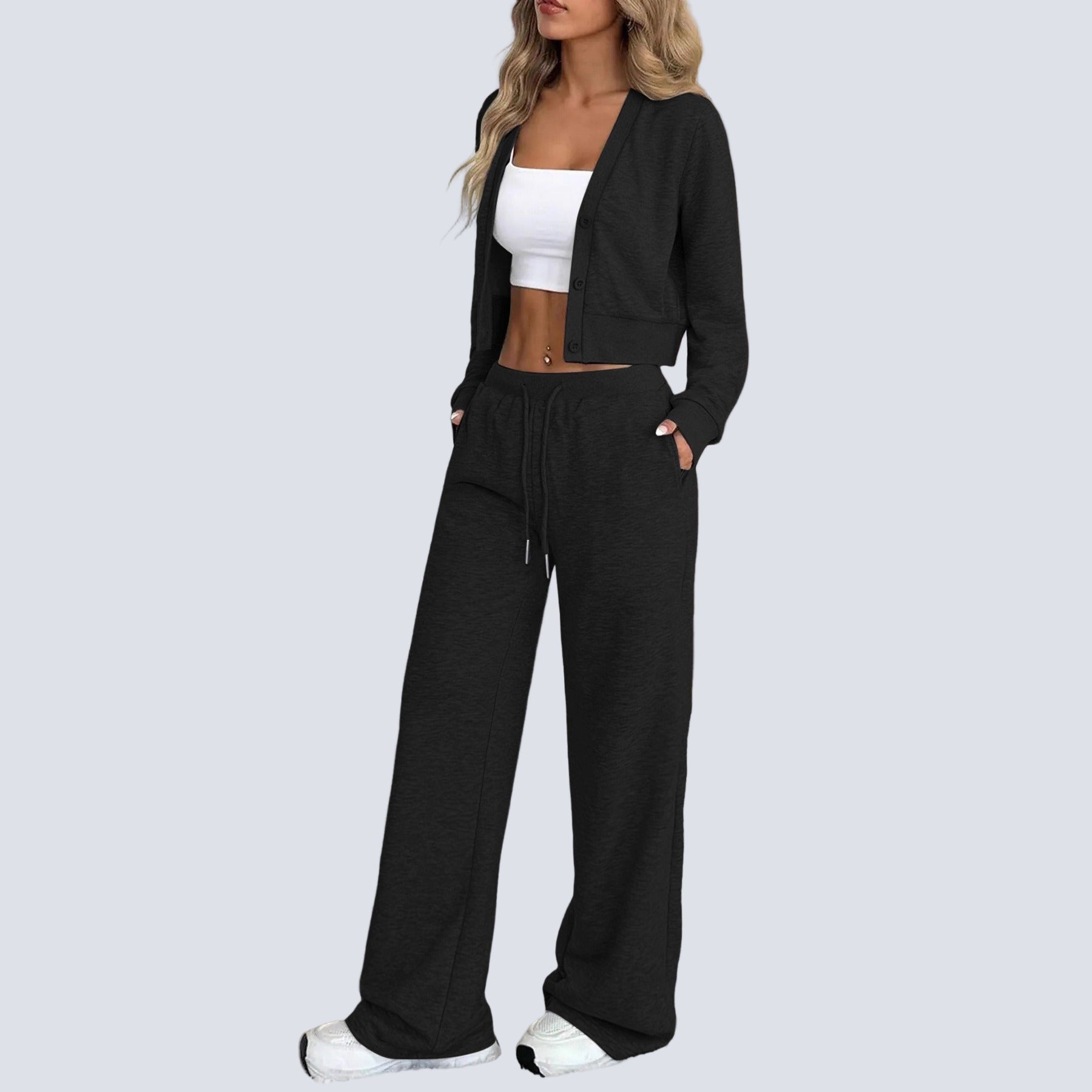 Tvådelad stickad kostym med blus med knappar framtill