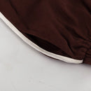 Tvådelat linneset, mörkbrunt, löst sittande, med utsvängda byxor