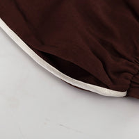 Tvådelat linneset, mörkbrunt, löst sittande, med utsvängda byxor