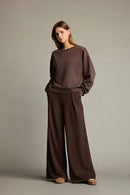 Veya sportdräkt med utsvängda byxor