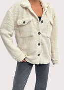 Vit jacka med slag och knappar