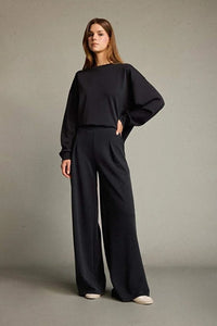 Veya sportdräkt med utsvängda byxor