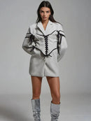 Långärmad jacka med knappar och korsett