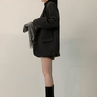 Eléora mellanlång, löst sittande ullkavaj