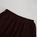 Tvådelat linneset, mörkbrunt, löst sittande, med utsvängda byxor