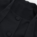 Grått tvådelat set med kjol, långa ärmar och fluga