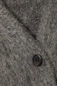 Kort stickad kofta med V-ringning, knappar, enkel rad med knappar