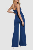 Ärmlös denimjumpsuit med V-ringning, utsvängda ben och dragkedja bak