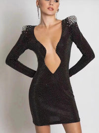 Svart smal tvådelad klänning med långa ärmar, paljetter och djup halsringning