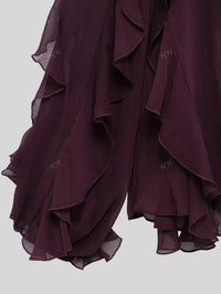 Inna vinröd blus med lager på lager volanger och knappar