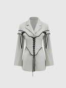 Långärmad jacka med knappar och korsett