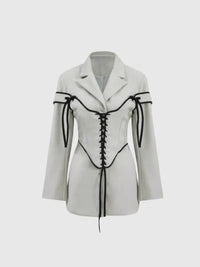 Långärmad jacka med knappar och korsett